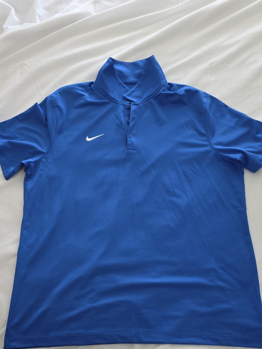 Nike Men’s Blue Polo with White Swoosh